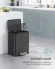 A black kitchen trash can with a soft-close lid is shown in a modern kitchen setting. Produktbild-Vorschau