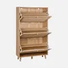 A wooden shoe cabinet with three flip-down drawers, each with a rattan-woven front panel. Produktbild-Vorschau