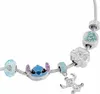 A close-up shot of a charm bracelet with various charms, including a Stitch character charm. Podgląd zdjęcia produktu