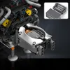 A close-up view of a complex mechanical engine model, likely a toy or display piece, with intricate details and multiple components. Voir les images du produit