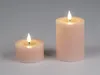 Two LED candles of different sizes on a plain background. Produktbild-Vorschau