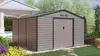 A metal garden shed is shown in a backyard setting with landscaping and a pool in the background. Anteprima dell’immagine prodotto