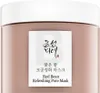 A close-up of a skincare product jar with its label. Produktbild-Vorschau