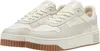 A pair of beige Puma sneakers with brown soles. Produktbild-Vorschau