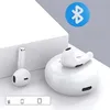 A white charging case with one earbud resting on top, and another earbud to the left, with a blue Bluetooth logo in the upper right corner. Produktbild-Vorschau