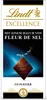 A chocolate bar wrapper with a diamond-shaped piece of chocolate on a blue background. Produktbild-Vorschau