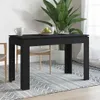 A black dining table is shown in a room with a plant and chairs. Náhled obrázku produktu