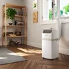 A portable air conditioner is shown in a room with a shelf and a window. Produktbild-Vorschau