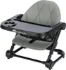 A close-up studio shot of a portable baby booster seat. Voir les images du produit