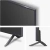 A collage of three images showing different angles of an LG QNED TV, including a close-up of the screen bezel, the left side of the stand, and the right side of the stand. Voir les images du produit