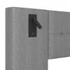 A close-up view of a gray upholstered headboard with a black reading lamp and USB port attached. Podgląd zdjęcia produktu
