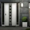 A modern front door with a wall lamp and a potted plant. Produktbild-Vorschau