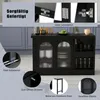 A black sideboard with glass doors and shelves, displayed in a kitchen-like setting with some decorative items on top. Anteprima dell’immagine prodotto
