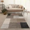 A living room scene with a sofa, rug, and side table. Produktbild-Vorschau