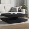 A modern living room scene with a couch and a black coffee table. Náhľad obrázku produktu