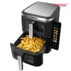 A close-up shot of a black air fryer filled with french fries. Produktbild-Vorschau