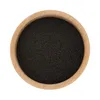 A top-down view of ground black cumin seeds in a wooden bowl. Náhled obrázku produktu