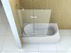 A modern bathroom with a white bathtub and a clear glass shower screen. Produktbild-Vorschau