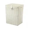 A white wicker laundry basket with a fabric lid and a buckle closure, isolated on a white background. Náhľad obrázku produktu