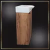 A white sink sits atop a tall, narrow cabinet with a wood-grain finish. The background is dark and features a gradient effect. Podgląd zdjęcia produktu