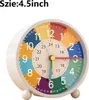 A colorful analog alarm clock with a white casing and a white background. Produktbild-Vorschau