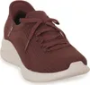 A single red sneaker with a beige sole is shown against a white background. Voir les images du produit
