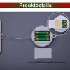 A close-up view of a battery compartment for a decorative light, showing AAA batteries inserted. Produktbild-Vorschau
