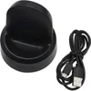 A black charging dock and a black USB cable are shown on a white background. Náhľad obrázku produktu