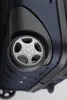 Close-up view of the wheel and bottom of a dark blue suitcase. Anteprima dell’immagine prodotto