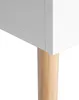 A close-up view of the corner of a white cabinet with a wooden leg. Náhľad obrázku produktu