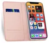 A pink flip case for an iPhone 13 Pro Max is shown open, with a credit card inserted into a slot on the left side and the phone displaying its home screen on the right. Anteprima dell’immagine prodotto