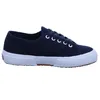 A single navy blue Superga sneaker with white laces and a white sole is shown against a white background. Produktbild-Vorschau