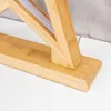 Close-up of the base and lower part of a wooden LED lamp. Produktbild-Vorschau