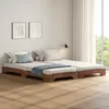 Two beds are placed side-by-side in a room with natural light coming from a large window. Produktbild-Vorschau