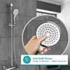 A hand holding a shower head with a close-up view of the nozzles, with a shower fixture in the background. Anteprima dell’immagine prodotto