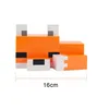 A close-up, front-facing view of a stylized, blocky orange fox figurine against a white background. A measurement line indicating 16cm is visible at the bottom. Voir les images du produit