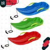 Collage of three sleds in different colors (blue, green, red) with yellow handles and black ropes with handles. Náhled obrázku produktu