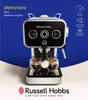 A Russell Hobbs espresso machine is shown with two cups of espresso, against a blue and white background. Produktbild-Vorschau