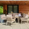 A woman reading a book on a patio furniture set. Náhľad obrázku produktu