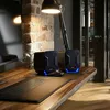 A desk setup with speakers, a laptop, and a lamp. Náhľad obrázku produktu