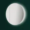 A circular mirror with a soft glow around it against a dark green background. Anteprima dell’immagine prodotto