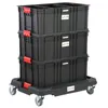 A stack of three black storage boxes with red latches on a black wheeled platform. Náhled obrázku produktu