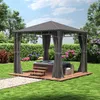 A gazebo with a hot tub inside, set up in a backyard garden. Náhled obrázku produktu