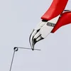 A close-up shot of Knipex electronics pliers cutting a wire. Anteprima dell’immagine prodotto