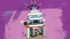 A LEGO Friends building set is displayed against a purple background with decorative elements. Produktbild-Vorschau