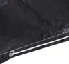 A close-up view of the edge of a black tarp or cover, showing a reinforced grommet and a white drawstring. Náhľad obrázku produktu