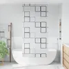 A modern bathroom with a freestanding bathtub and a shower curtain with a geometric pattern. Náhled obrázku produktu