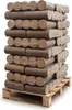 A stack of compressed wood briquettes on a wooden pallet. Produktbild-Vorschau