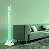 A bubble column lamp with decorative fish is placed next to a sofa in a living room. Produktbild-Vorschau