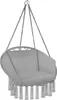 A hanging chair with macrame fringe detail. Voir les images du produit